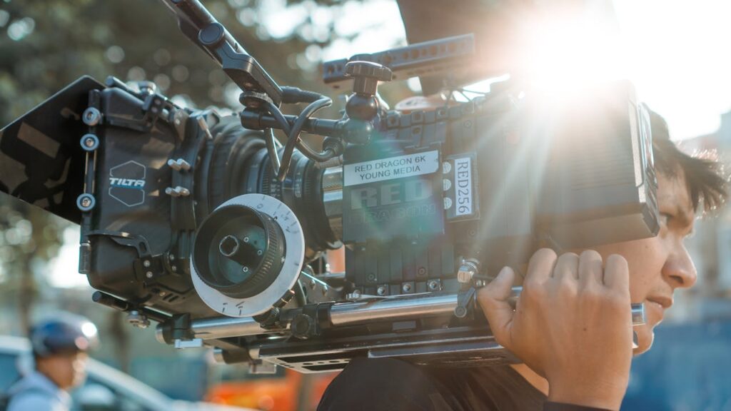 Photo Of Man Carrying Camera Euqipment